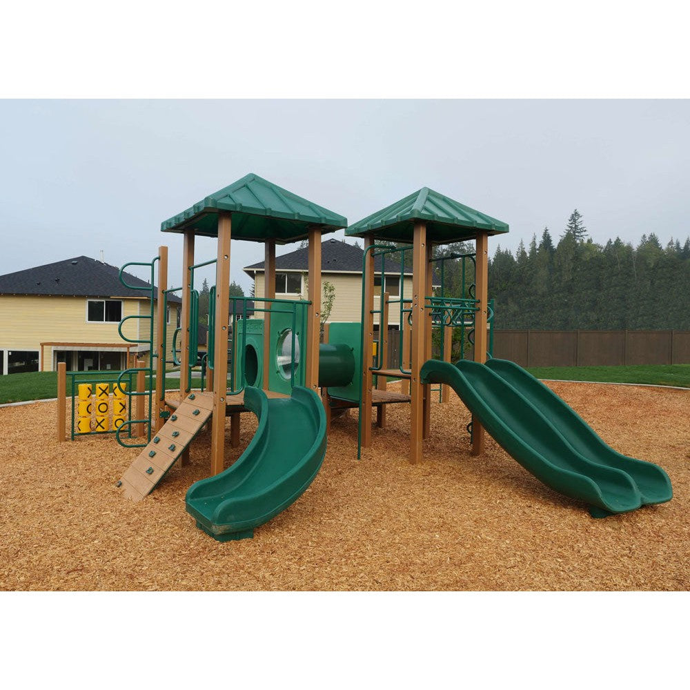 School-scale commercial play structure with decks, slides and climbing panels