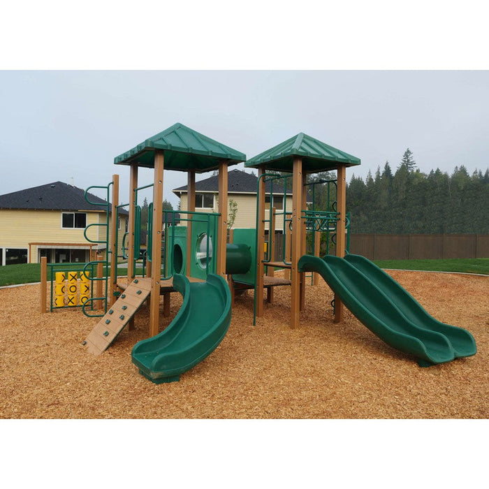 School-scale commercial play structure with decks, slides and climbing panels