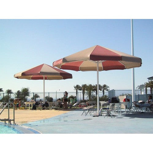 OWS Coolbrella single-post fabric shade structure installed over a pool and patio area